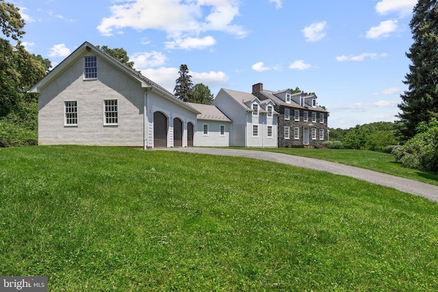 453 Bayard Rd, Kennett Square, PA 19348 - view of front facade with a garage, asphalt driveway, a front lawn, and stucco siding