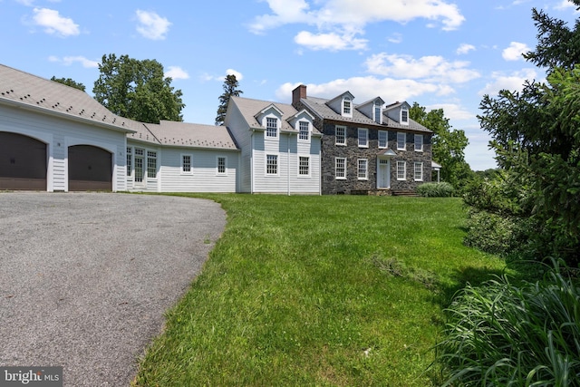 453 Bayard Rd, Kennett Square, PA 19348 - view of front of home featuring a front lawn, stone siding, driveway, and a chimney