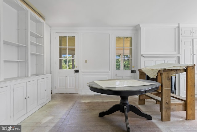 453 Bayard Rd, Kennett Square, PA 19348 - dining space with healthy amount of natural light, a decorative wall, and light wood-type flooring