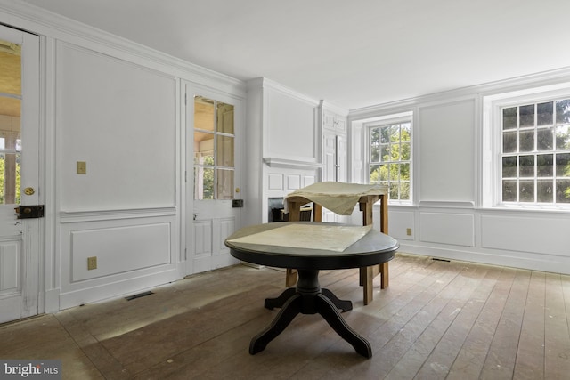 453 Bayard Rd, Kennett Square, PA 19348 - dining space with a decorative wall, ornamental molding, and light wood finished floors