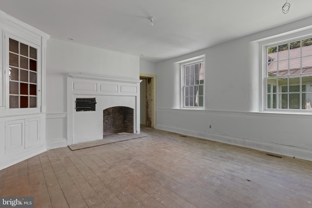 453 Bayard Rd, Kennett Square, PA 19348 - unfurnished living room with a fireplace with raised hearth and wood-type flooring