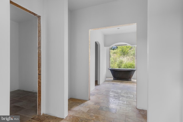 453 Bayard Rd, Kennett Square, PA 19348 - hallway featuring stone tile flooring and arched walkways