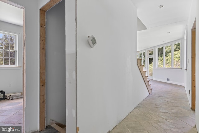 453 Bayard Rd, Kennett Square, PA 19348 - hall featuring healthy amount of natural light, stone tile flooring, and stairway