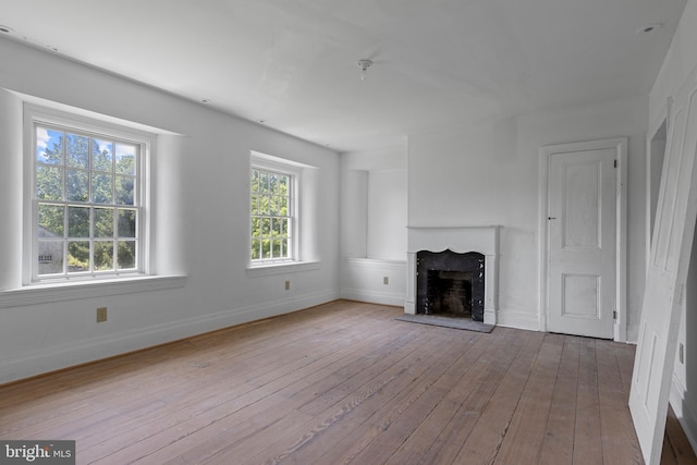 453 Bayard Rd, Kennett Square, PA 19348 - unfurnished living room with hardwood / wood-style floors and a fireplace with raised hearth