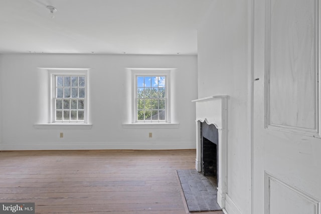 453 Bayard Rd, Kennett Square, PA 19348 - unfurnished living room with hardwood / wood-style flooring and a fireplace with flush hearth
