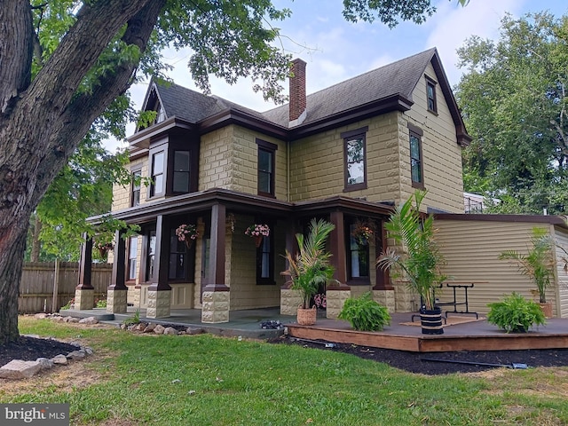 421 C St, Carlisle, PA 17013 - view of front of home featuring a porch, a chimney, roof with shingles, and stone siding