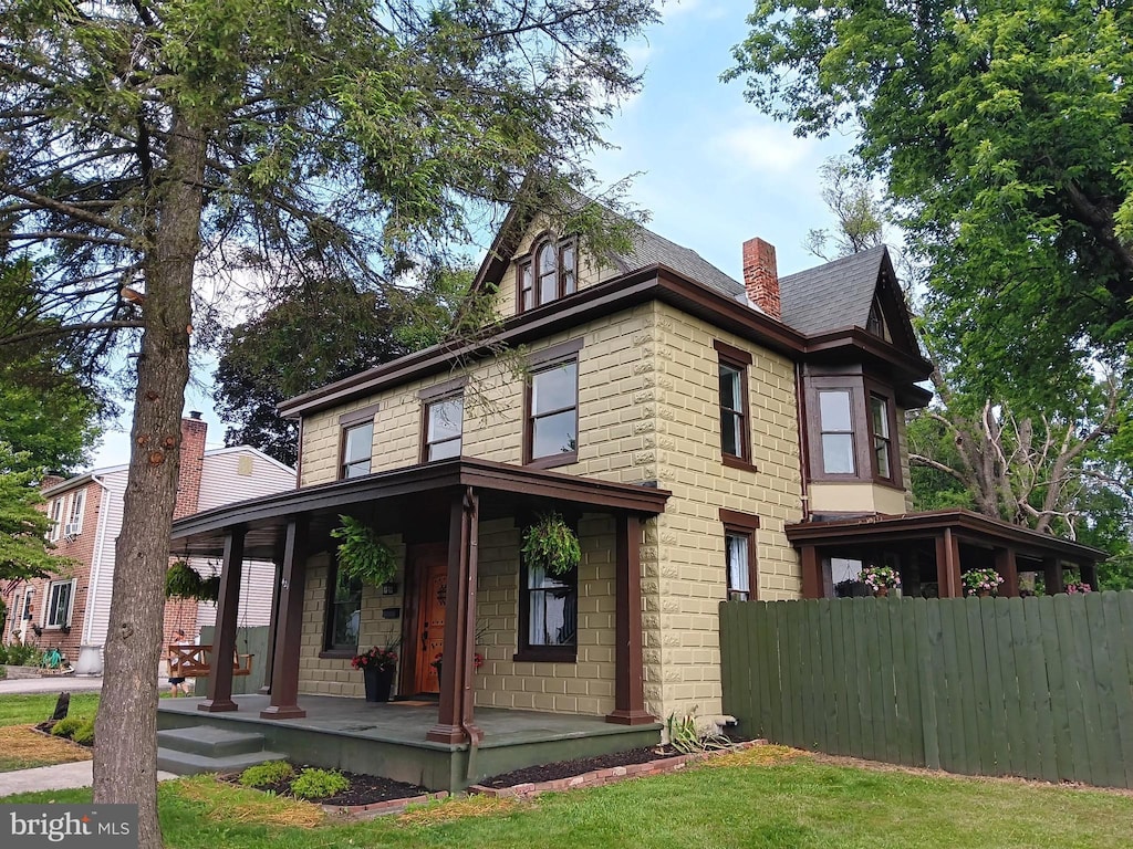 421 C St, Carlisle, PA 17013 - view of front facade featuring a chimney and a porch