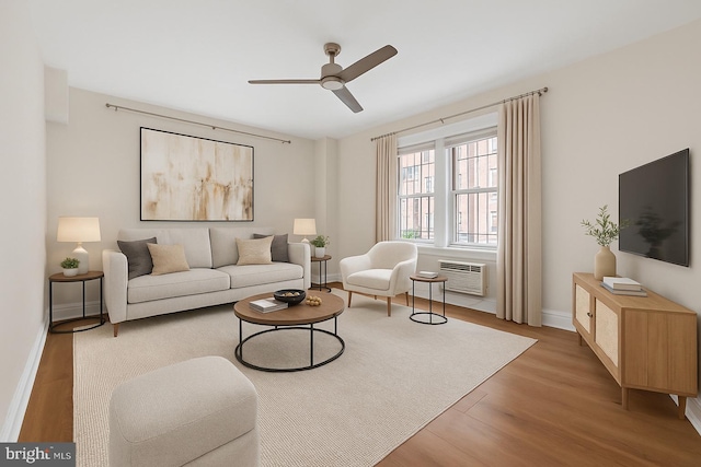 1954 Columbia Rd NW Unit 112, Washington, DC 20009 - living room with ceiling fan, a wall mounted air conditioner, and wood finished floors