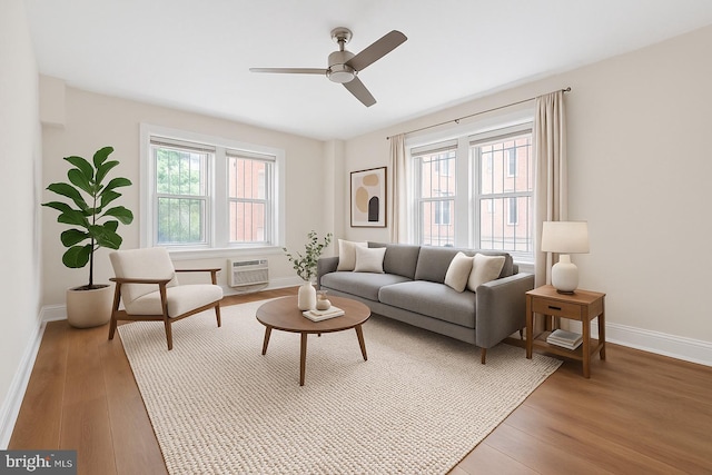 1954 Columbia Rd NW Unit 112, Washington, DC 20009 - living room with ceiling fan, a wall unit AC, and light wood-type flooring