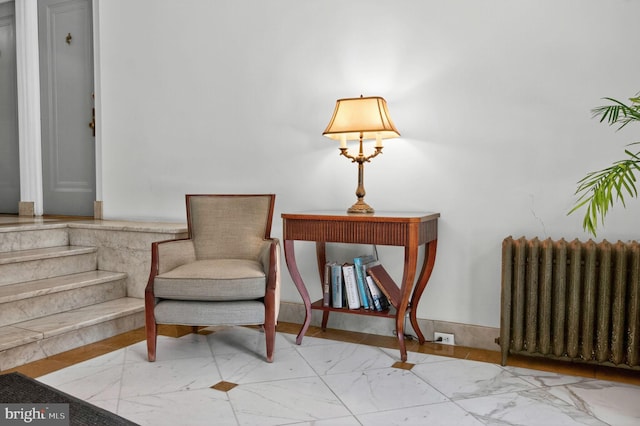1954 Columbia Rd NW Unit 112, Washington, DC 20009 - sitting room featuring radiator and marble look tile flooring