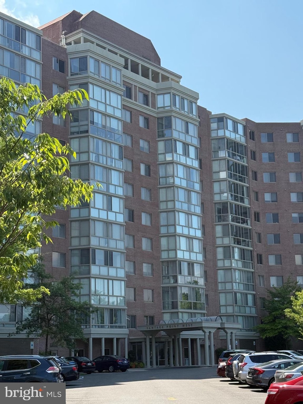 3210 N Leisure World Blvd Unit 1021, Silver Spring, MD 20906 - view of apartment building / complex featuring uncovered parking