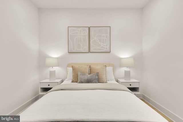507 L St NE Unit 3B, Washington, DC 20002 - bedroom featuring baseboards and wood finished floors