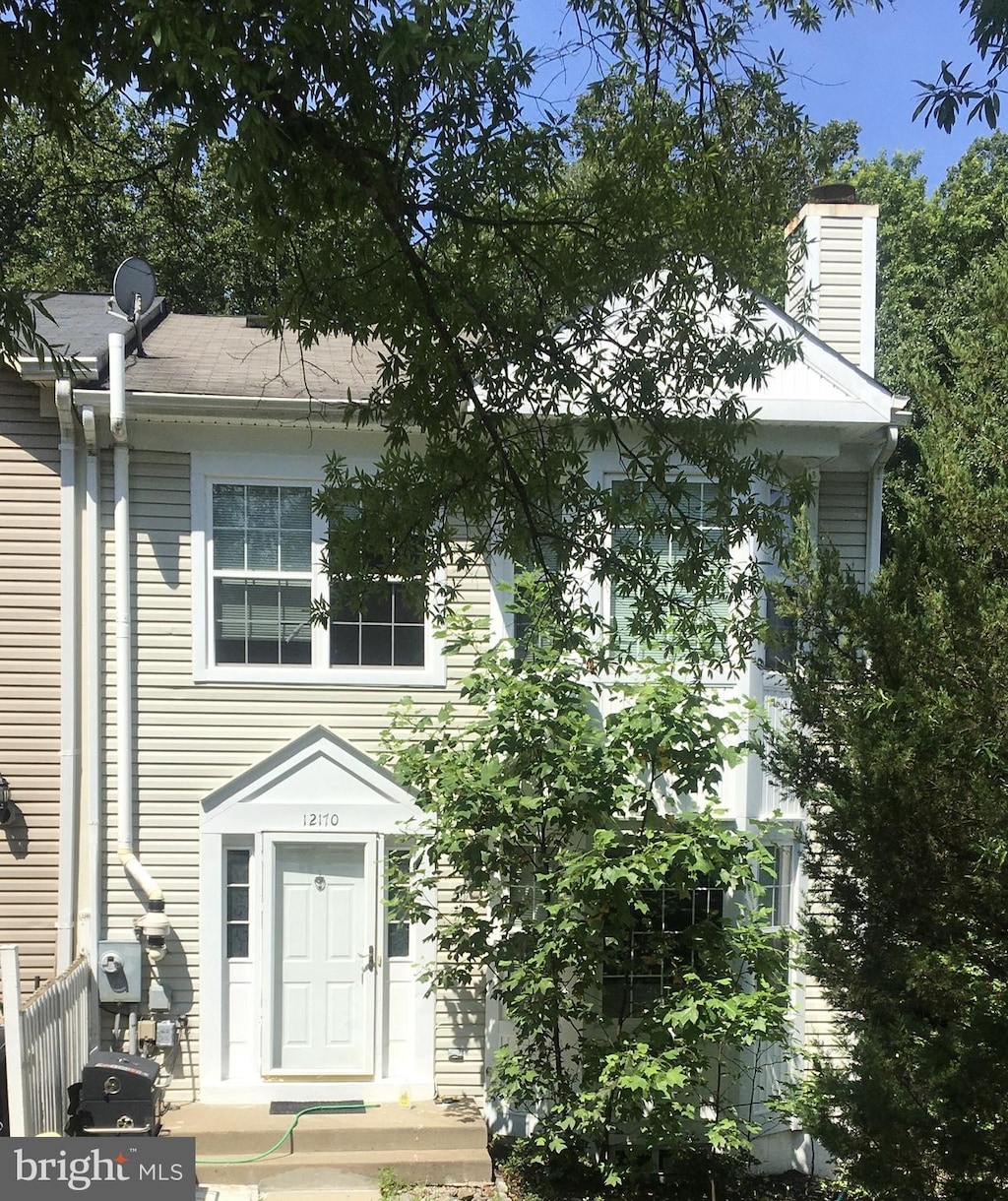 12170 Springwoods Dr, Woodbridge, VA 22192 - view of front of property featuring a chimney