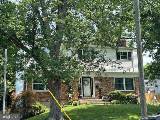 6013 Shaffer Dr, Alexandria, VA 22310 - view of front facade featuring a chimney and brick siding