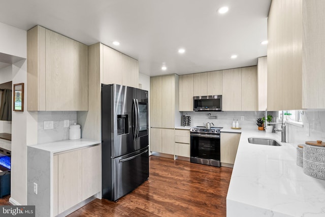 9304 Taverney Ter, Gaithersburg, MD 20879 - kitchen with appliances with stainless steel finishes, modern cabinets, backsplash, light stone counters, and recessed lighting