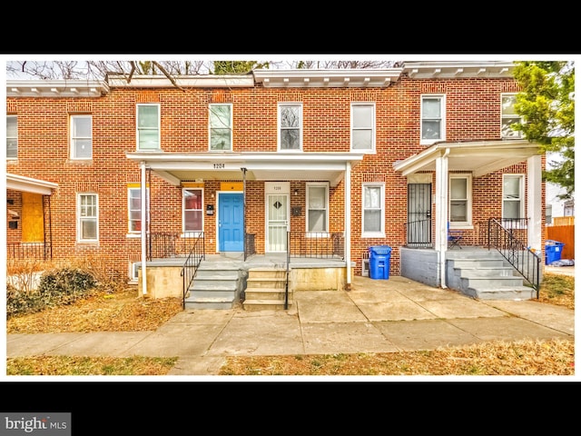 1206 Darley Ave, Baltimore, MD 21218 - view of property with brick siding and a porch