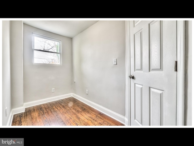 1206 Darley Ave, Baltimore, MD 21218 - empty room featuring wood finished floors and baseboards