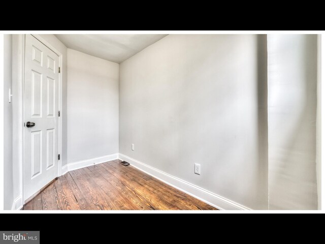 1206 Darley Ave, Baltimore, MD 21218 - unfurnished room featuring wood finished floors and baseboards