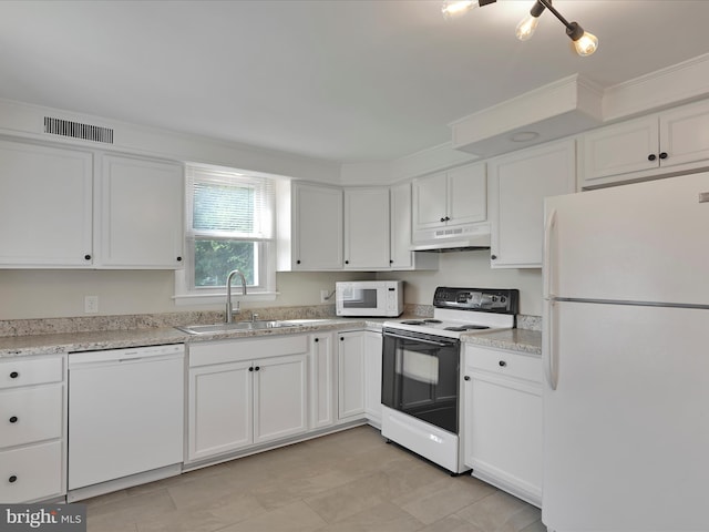 41 W George St, York, PA 17408 - kitchen with white appliances, white cabinets, and under cabinet range hood