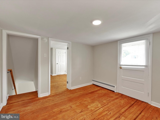 41 W George St, York, PA 17408 - unfurnished bedroom featuring a baseboard radiator and light wood-style floors