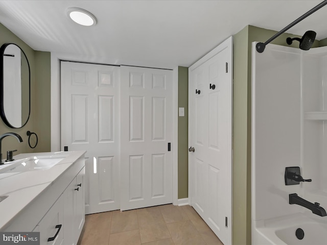 41 W George St, York, PA 17408 - bathroom featuring double vanity, tile patterned floors, washtub / shower combination, and a closet