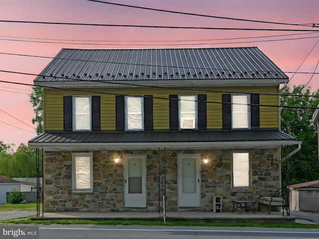 41 W George St, York, PA 17408 - view of front of property with covered porch, stone siding, and a metal roof