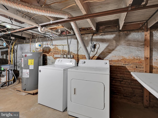 41 W George St, York, PA 17408 - washroom featuring water heater, washer and clothes dryer, and brick wall