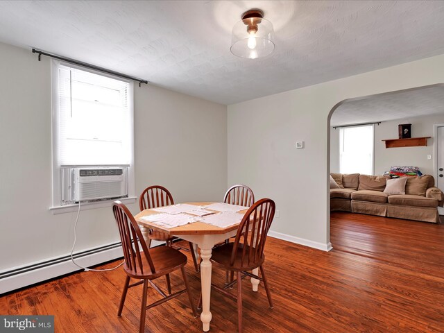 41 W George St, York, PA 17408 - dining room featuring wood finished floors, a baseboard heating unit, and cooling unit