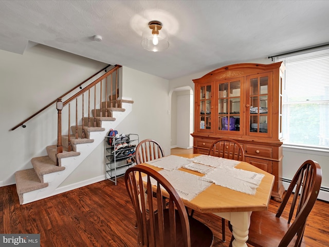 41 W George St, York, PA 17408 - dining space with stairway, arched walkways, and wood finished floors