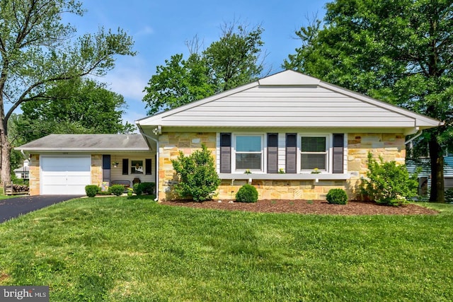 12112 Foxhill Ln, Bowie, MD 20715 - view of front of home featuring stone siding, a garage, driveway, and a front yard