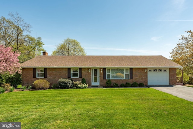 38 Skyview Ln, Lititz, PA 17543 - single story home featuring an attached garage, driveway, a chimney, a front lawn, and brick siding