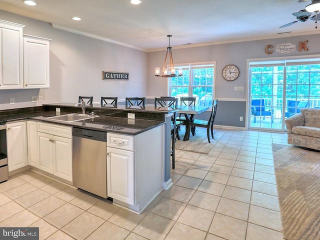 19988 Sandy Bottom Cir Unit 903, Rehoboth Beach, DE 19971 - kitchen featuring appliances with stainless steel finishes, light tile patterned floors, a peninsula, crown molding, and white cabinetry