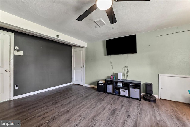 15 Pearson Dr, Springfield, PA 19064 - unfurnished living room featuring wood finished floors, ceiling fan, and a textured ceiling
