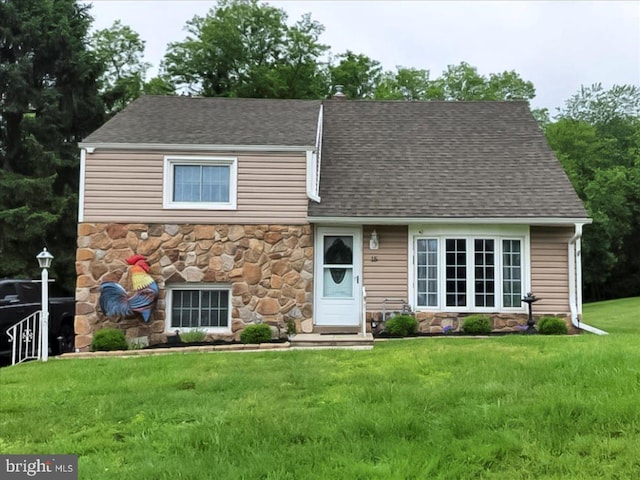 15 Pearson Dr, Springfield, PA 19064 - view of front facade featuring stone siding, a front lawn, and a shingled roof