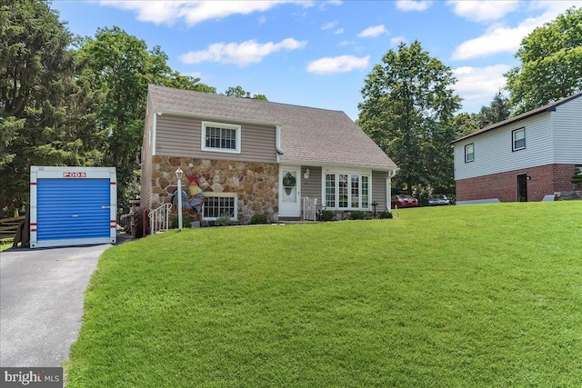 15 Pearson Dr, Springfield, PA 19064 - view of front of home with stone siding and a front yard