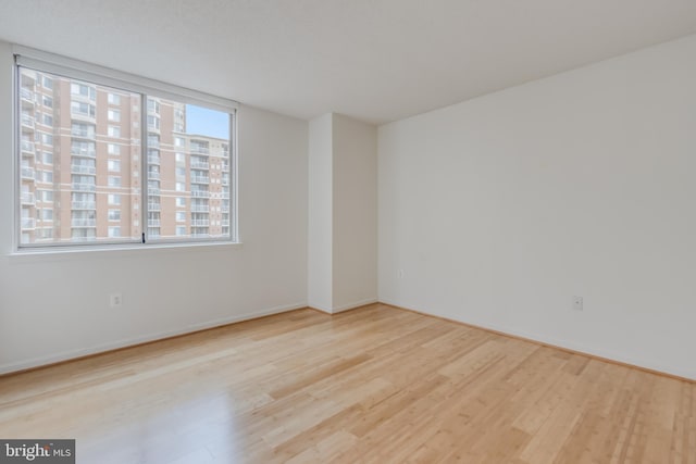 3835 9th St N Unit 1001W, Arlington, VA 22203 - empty room with wood finished floors and baseboards