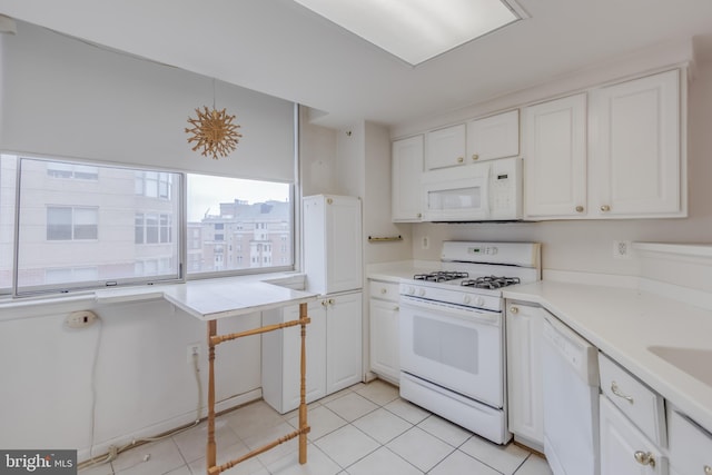 3835 9th St N Unit 1001W, Arlington, VA 22203 - kitchen featuring white appliances, white cabinetry, light countertops, and light tile patterned floors