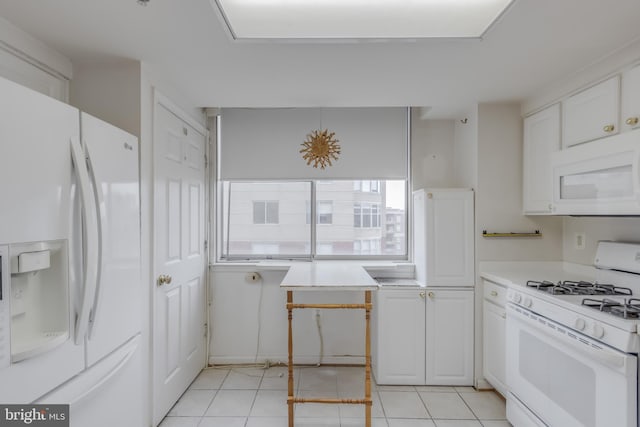 3835 9th St N Unit 1001W, Arlington, VA 22203 - kitchen featuring white appliances, light countertops, white cabinets, and light tile patterned floors