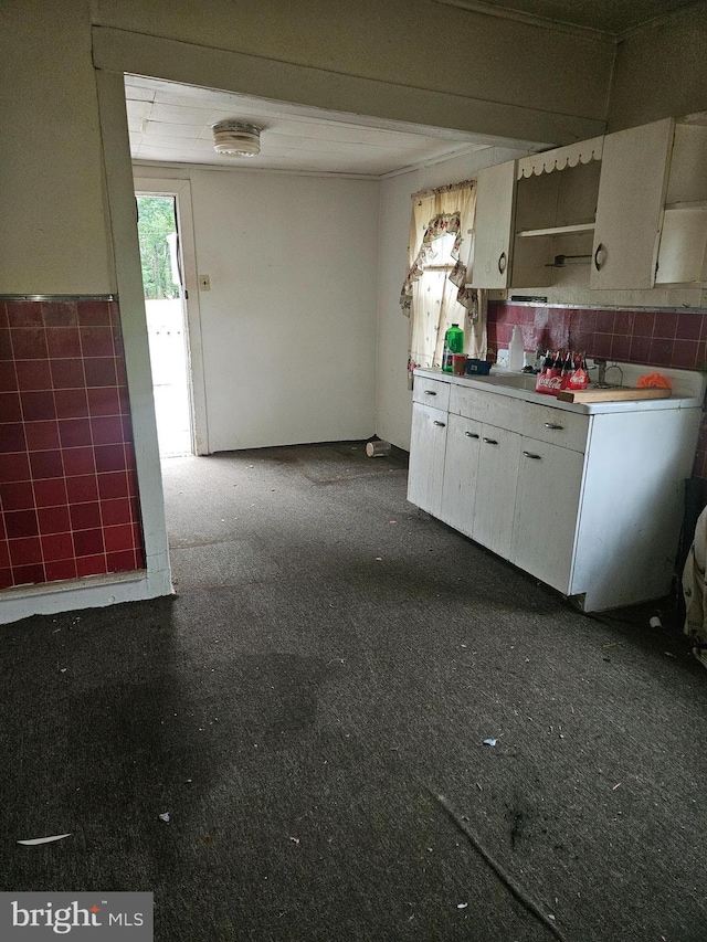 194 Blackwood Ave, Franklinville, NJ 08322 - kitchen with tile walls, light countertops, white cabinetry, and a wainscoted wall