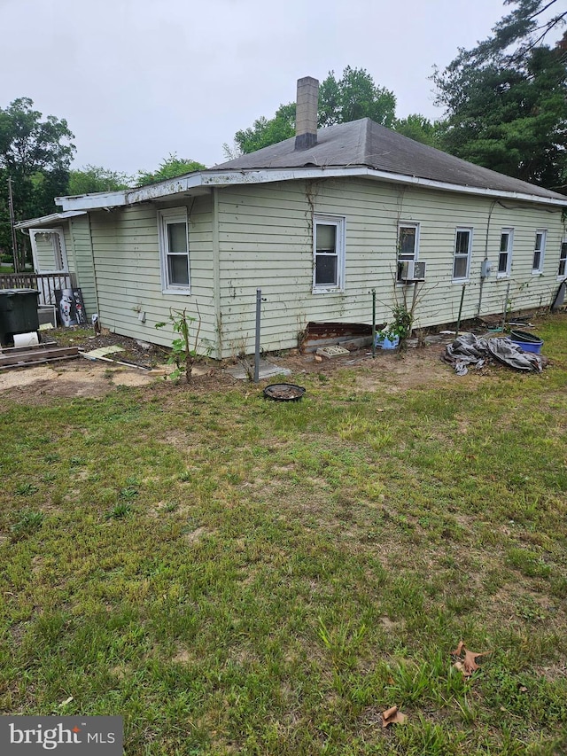 194 Blackwood Ave, Franklinville, NJ 08322 - back of property with a lawn, cooling unit, and a chimney