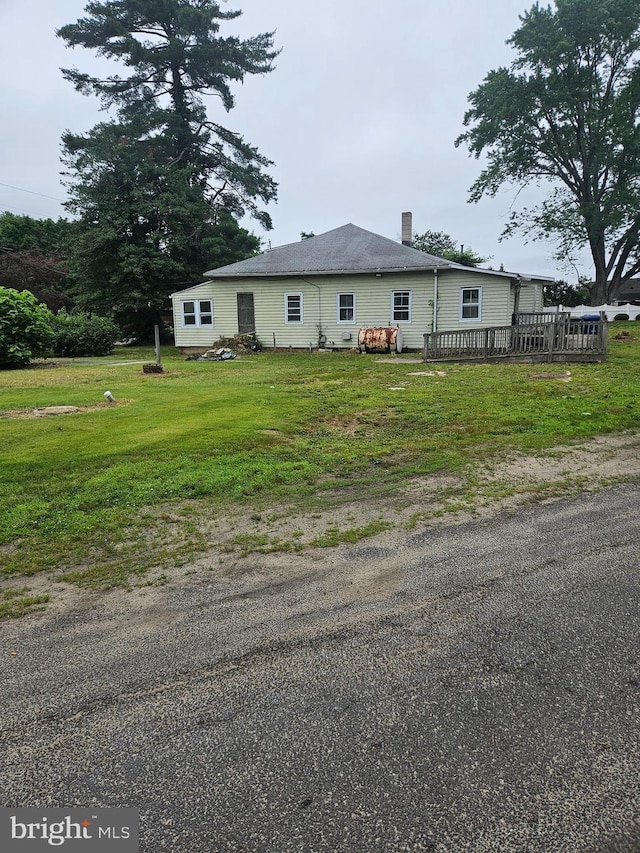 194 Blackwood Ave, Franklinville, NJ 08322 - view of front facade featuring a wooden deck, a front lawn, and a chimney