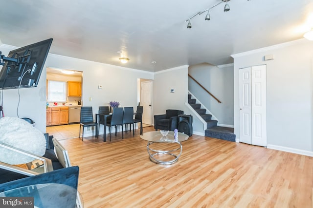 5349 Call Pl SE, Washington, DC 20019 - living room with ornamental molding, stairs, and light wood-style flooring