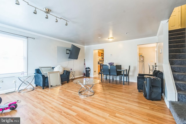 5349 Call Pl SE, Washington, DC 20019 - living area featuring stairway, light wood-style flooring, crown molding, and track lighting