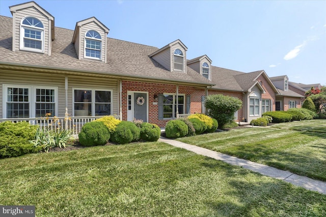 1339 Georgetown Cir, Carlisle, PA 17013 - cape cod house with roof with shingles, a front lawn, and brick siding