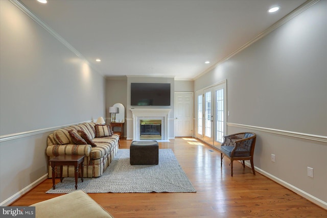 1339 Georgetown Cir, Carlisle, PA 17013 - living area featuring wood finished floors, crown molding, a fireplace with flush hearth, and recessed lighting