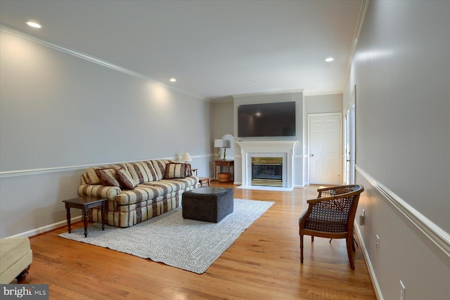 1339 Georgetown Cir, Carlisle, PA 17013 - living area with crown molding, a fireplace with flush hearth, wood finished floors, and recessed lighting