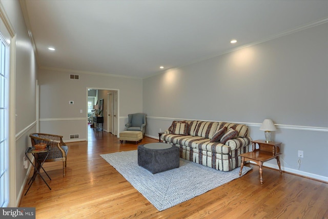 1339 Georgetown Cir, Carlisle, PA 17013 - living room featuring light wood-style flooring, ornamental molding, and recessed lighting