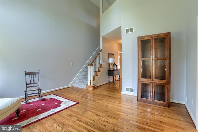 1339 Georgetown Cir, Carlisle, PA 17013 - unfurnished room featuring a high ceiling, wood finished floors, and stairway