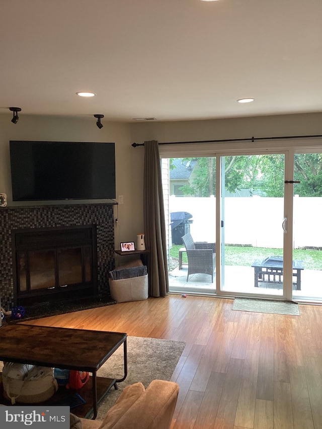 3703 Elberta Ln, Marlton, NJ 08053 - living area with a tile fireplace, wood finished floors, and recessed lighting