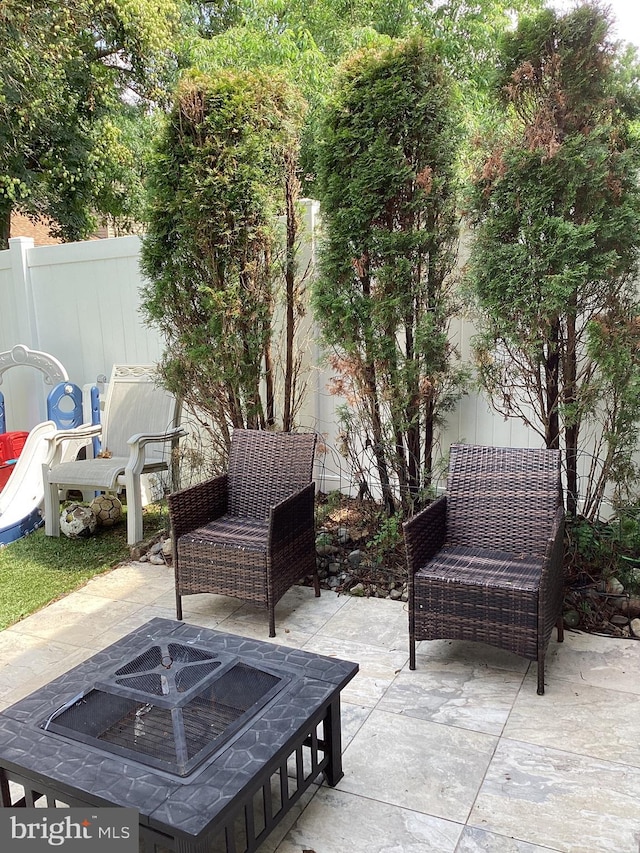 3703 Elberta Ln, Marlton, NJ 08053 - fenced backyard with a fire pit and a patio